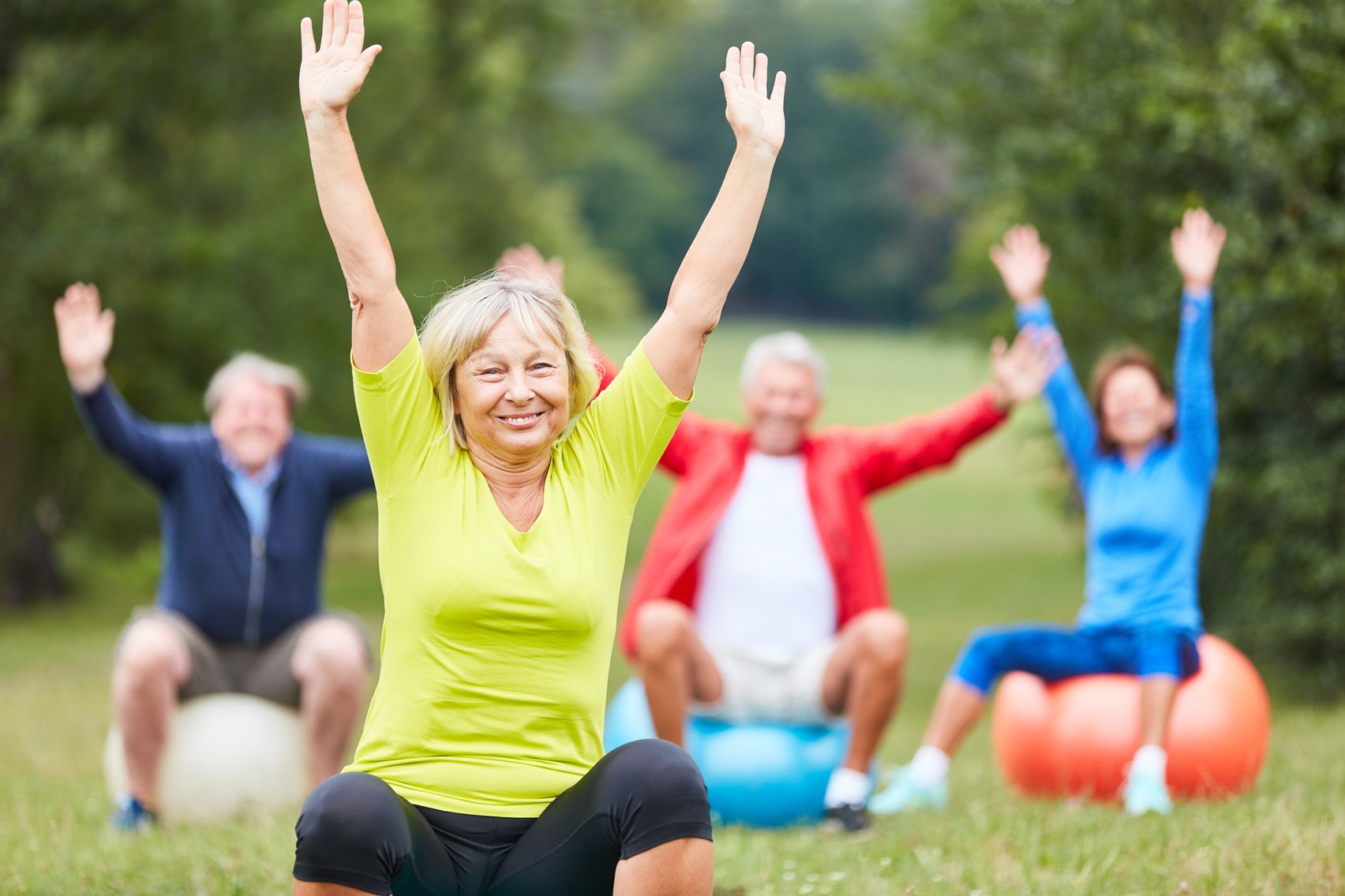 Active Senior Makes a Back Exercise